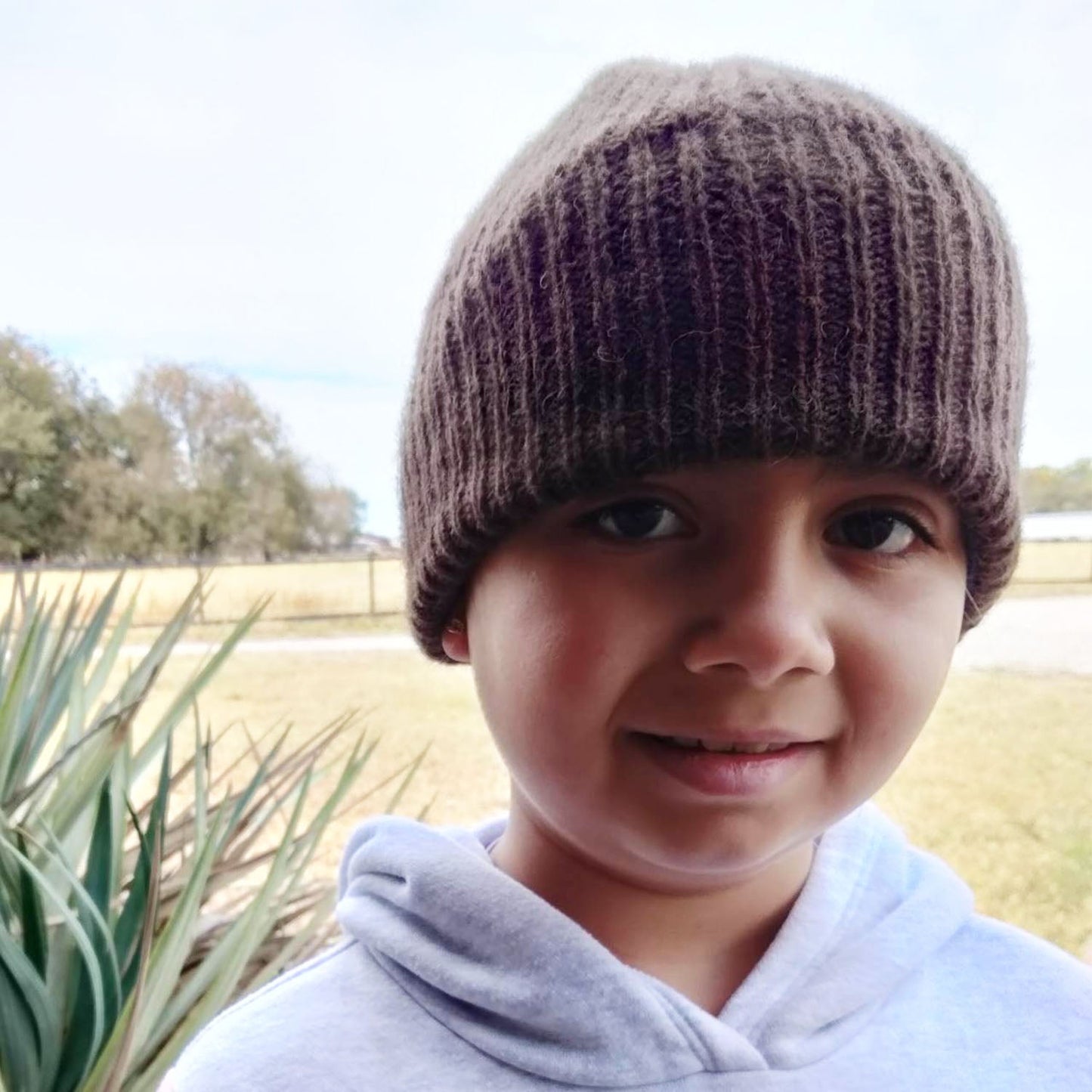 Bison Beanie with polar fleece lining; model is 7 yrs old